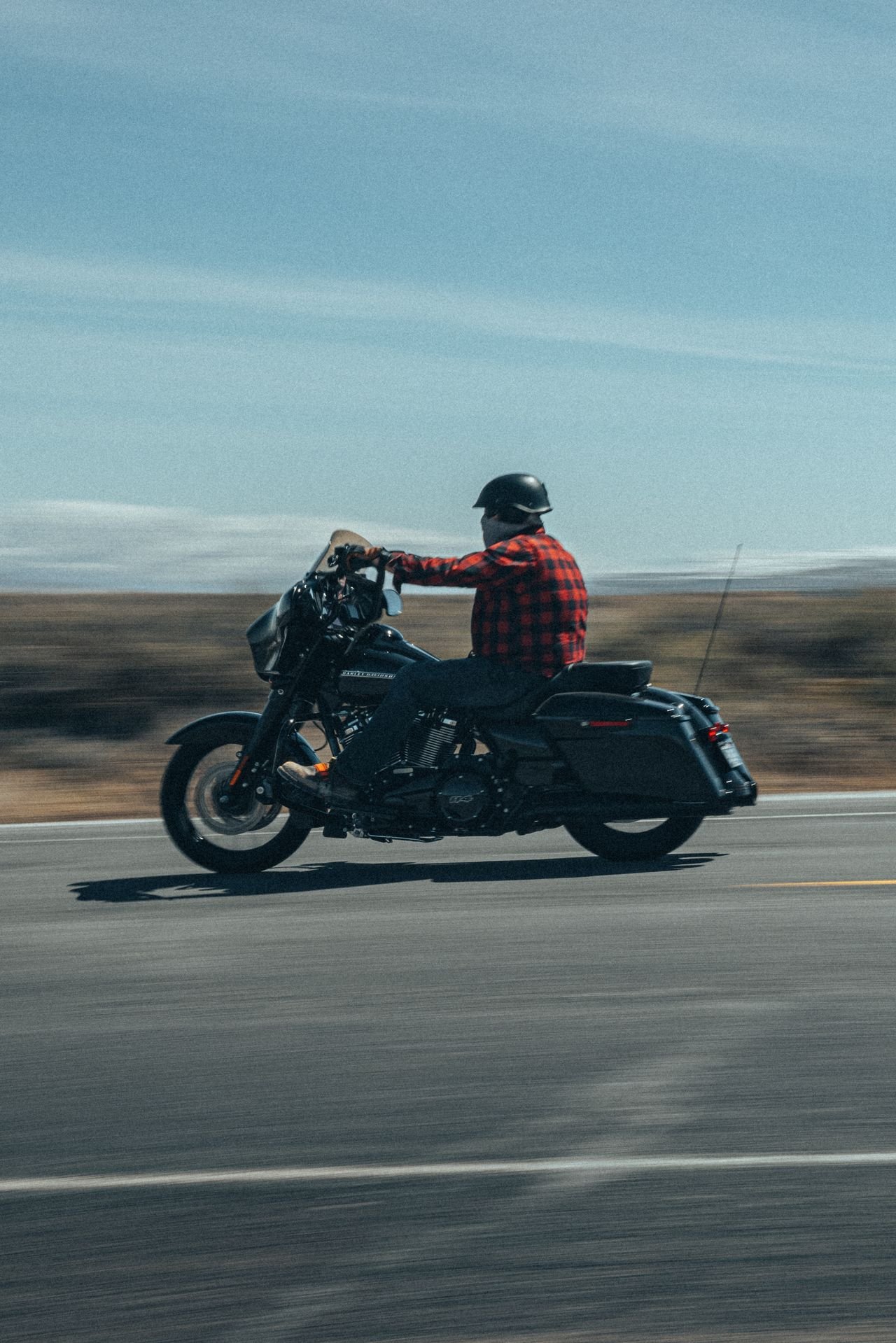 A motorcyclist riding on an open road